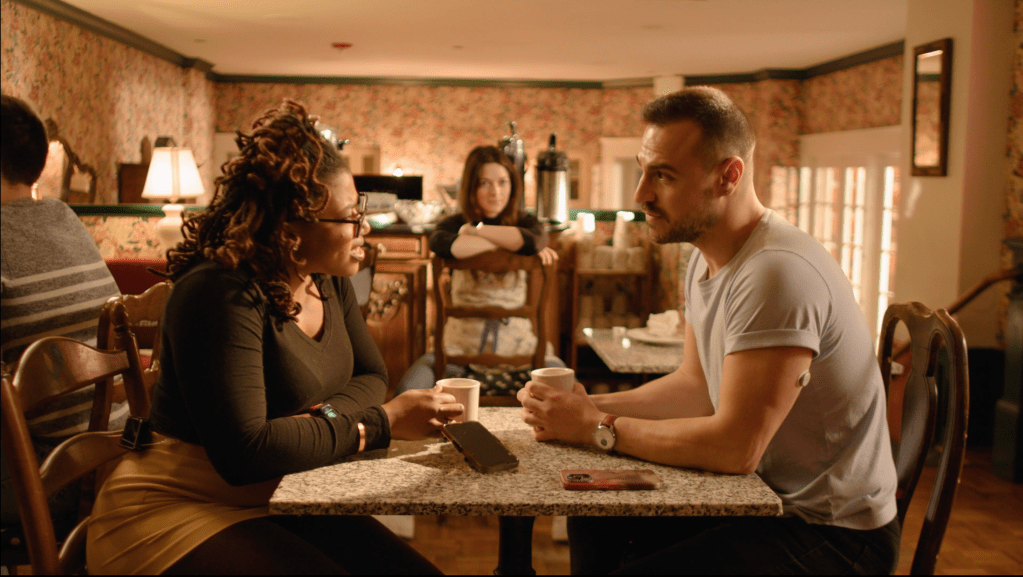 Three young adults sitting in a cafe talking. Still image from the Spoonful of Laughter campaign, developed by Matthew Garza at the diaTribe Foundation.